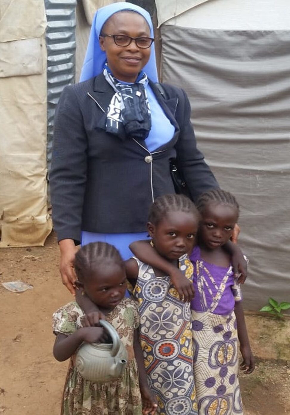 Rev. Sr. Carol Ijeoma Njoku providing humanitarian assistance to displaced children in Northern Nigeria, 2018 working with Win-Dream International and the Sanctuary Missionaries. 